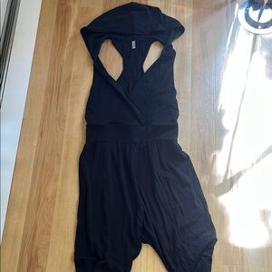 Free People Movement Black Hooded Jumpsuit. New Never Used without tags